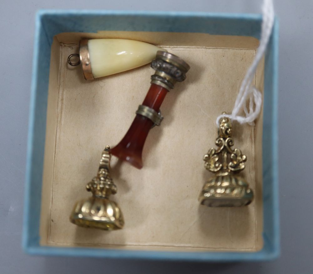 Three assorted Victorian seals including agate and citrine set, largest 26mm and a mounted tooth pendant.